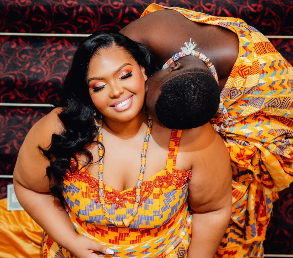 Traditional African wedding couple wearing colourful cultural attire during a traditional marriage celebration