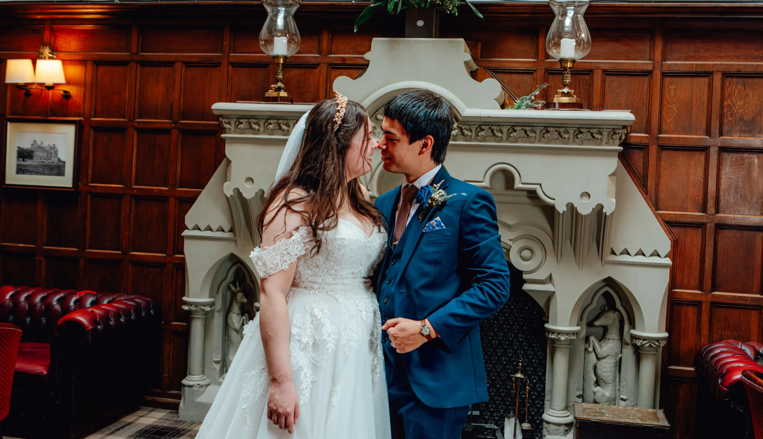 Wedding couple sharing a romantic moment indoors during their wedding day in the UK