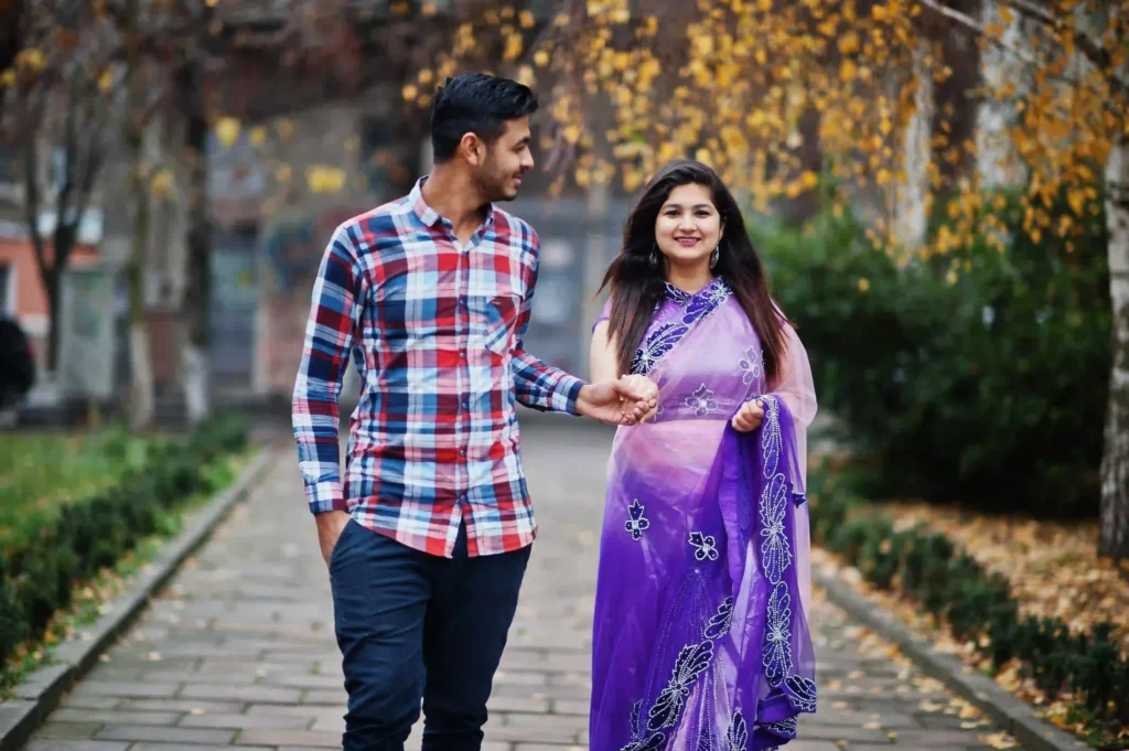 Indian couple walking hand in hand during lifestyle photography session in Cambridge UK