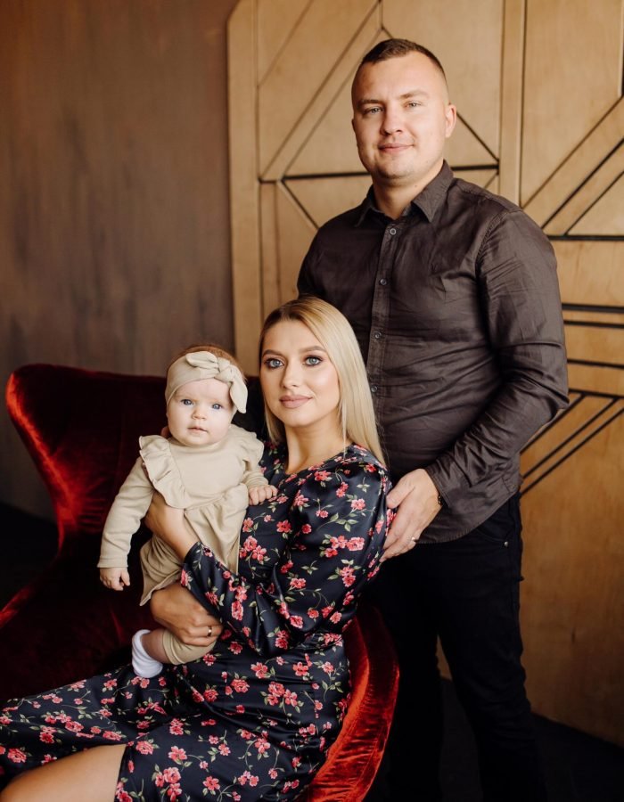 Portrait of a young family in the studio