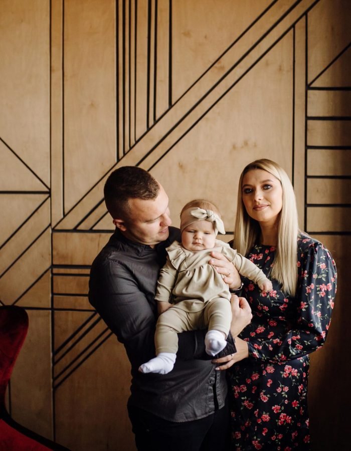 Portrait of a young family in the studio